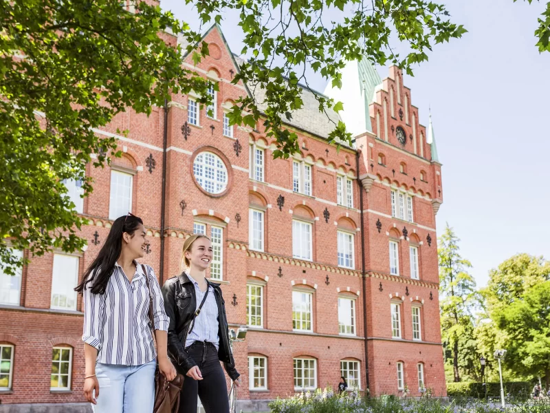 female-students-walking-in-front-of-library-2024-10-14-18-34-59-utc